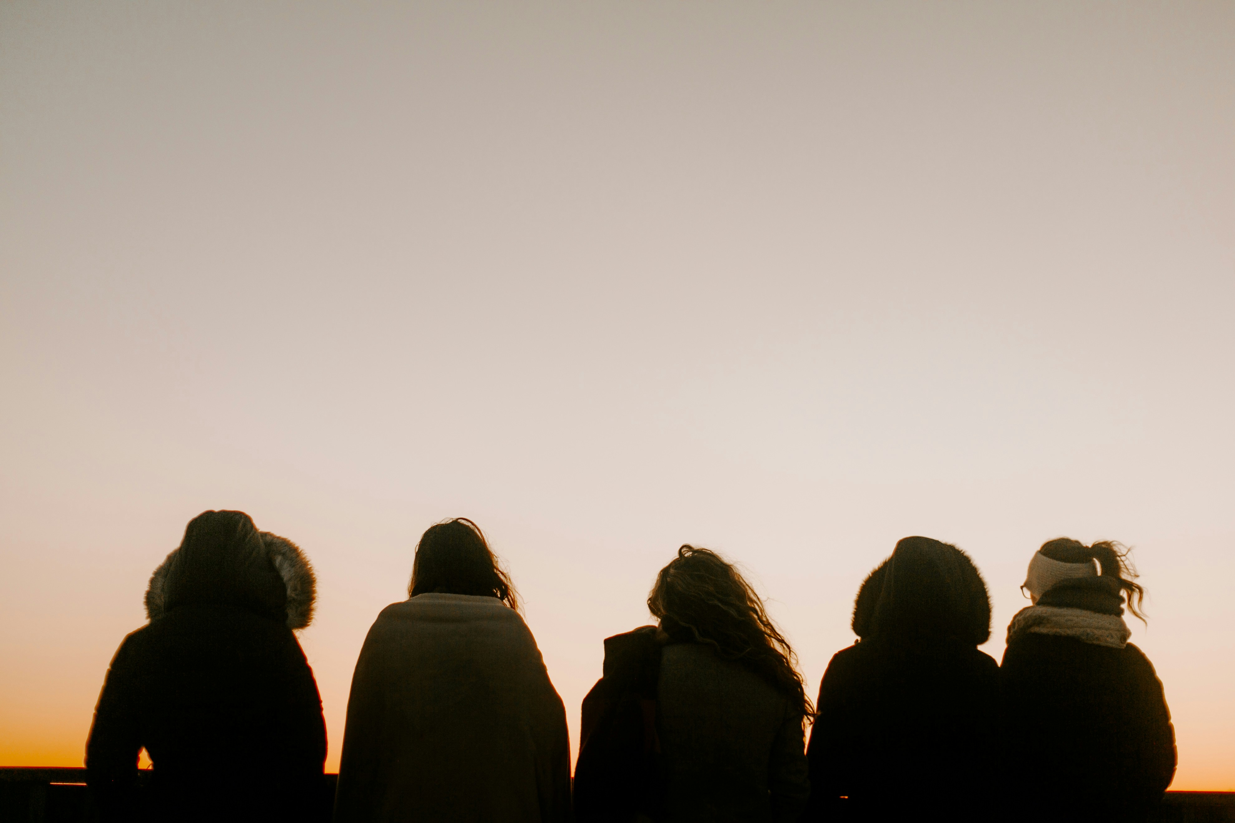 Five people sharing a sunset together